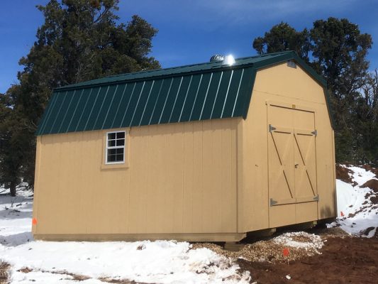 lofted barn with double doors, turbine vent